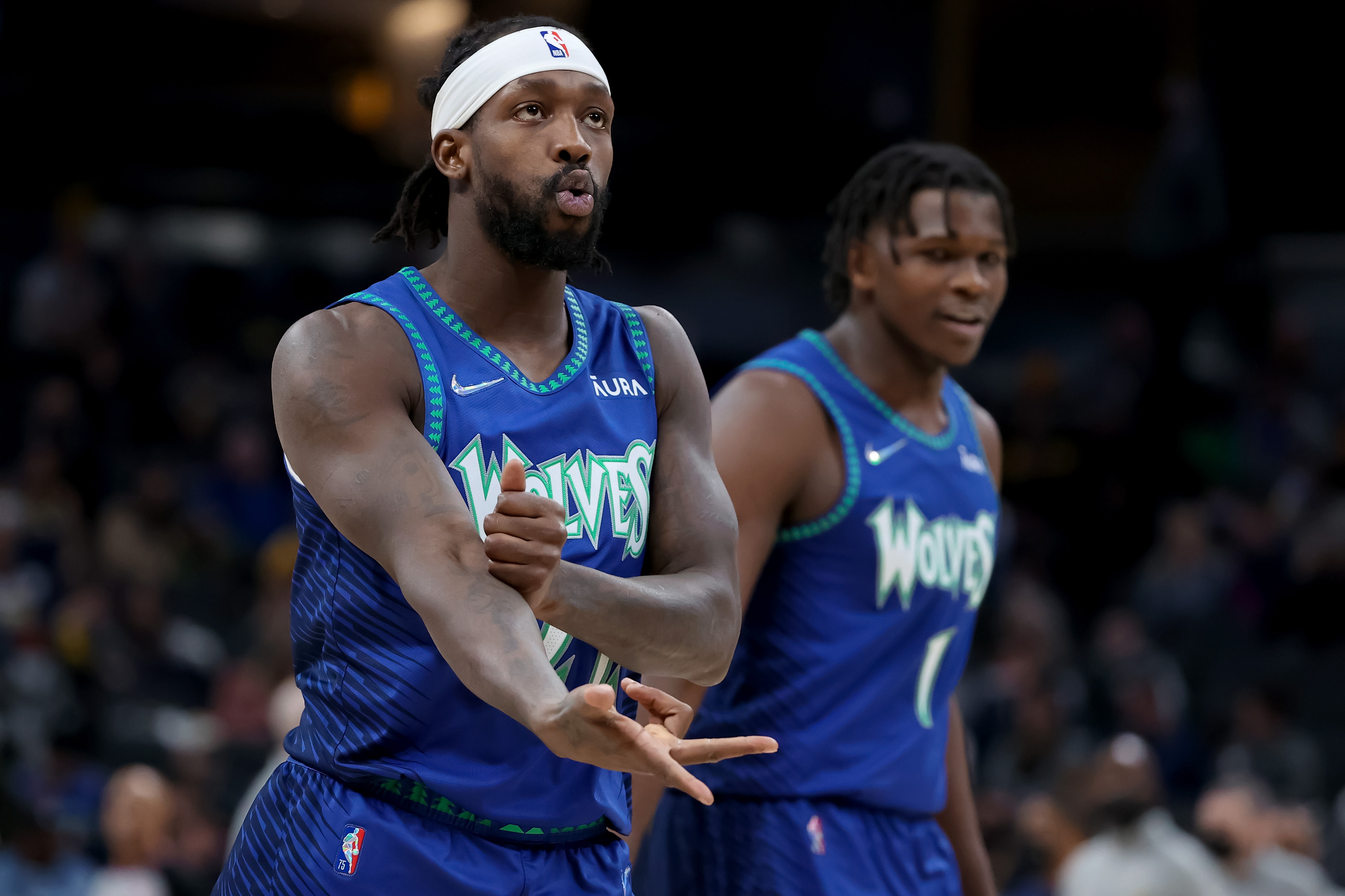 Patrick Beverley #22 of the Minnesota Timberwolves celebrates in the fourth quarter against the Indiana Pacers at Gainbridge Fieldhouse on February 13, 2022 in Indianapolis, Indiana.