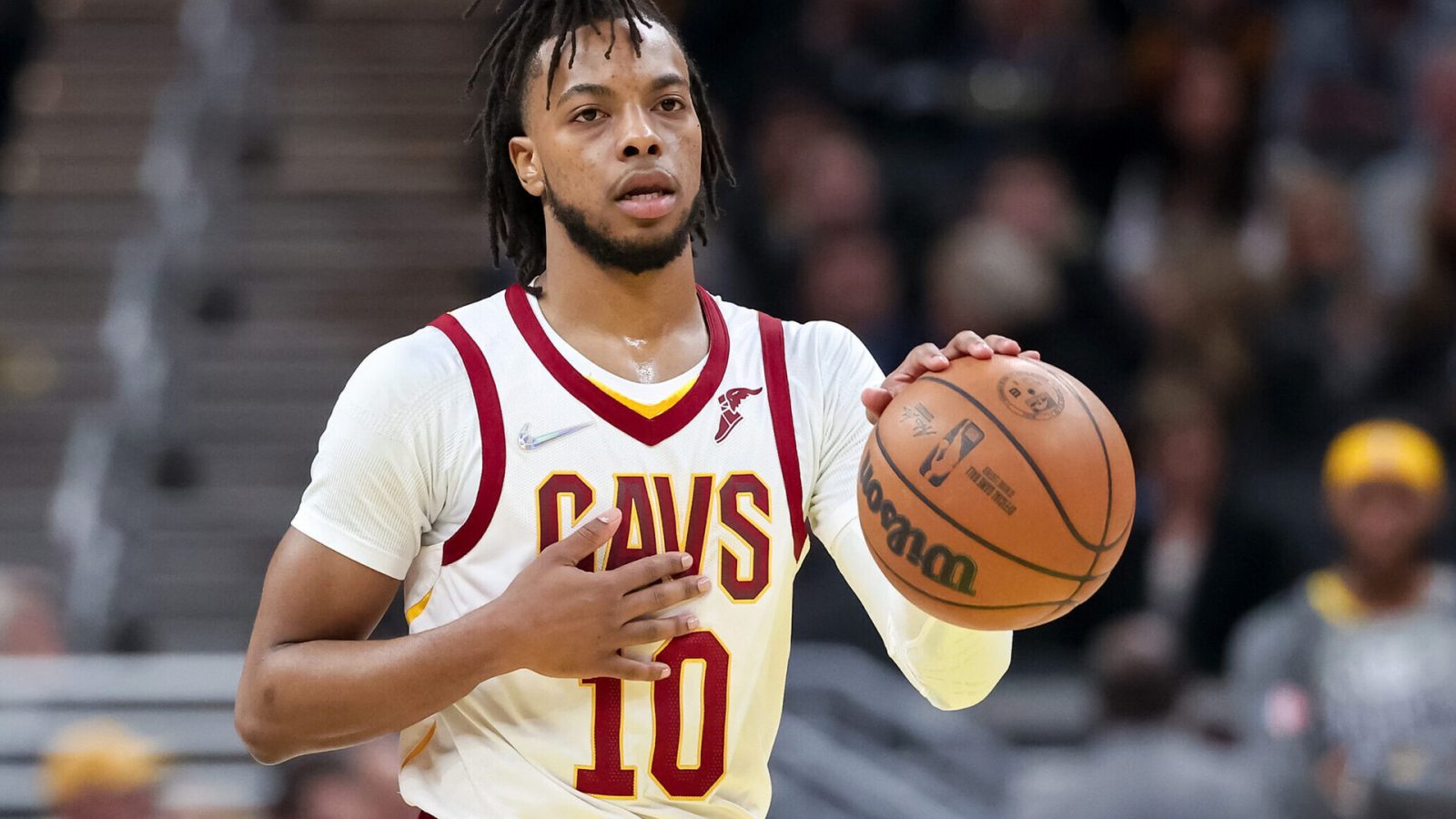Darius Garland #10 of the Cleveland Cavaliers dribbles the ball in the first quarter against the Indiana Pacers at Gainbridge Fieldhouse on March 08, 2022 in Indianapolis, Indiana.