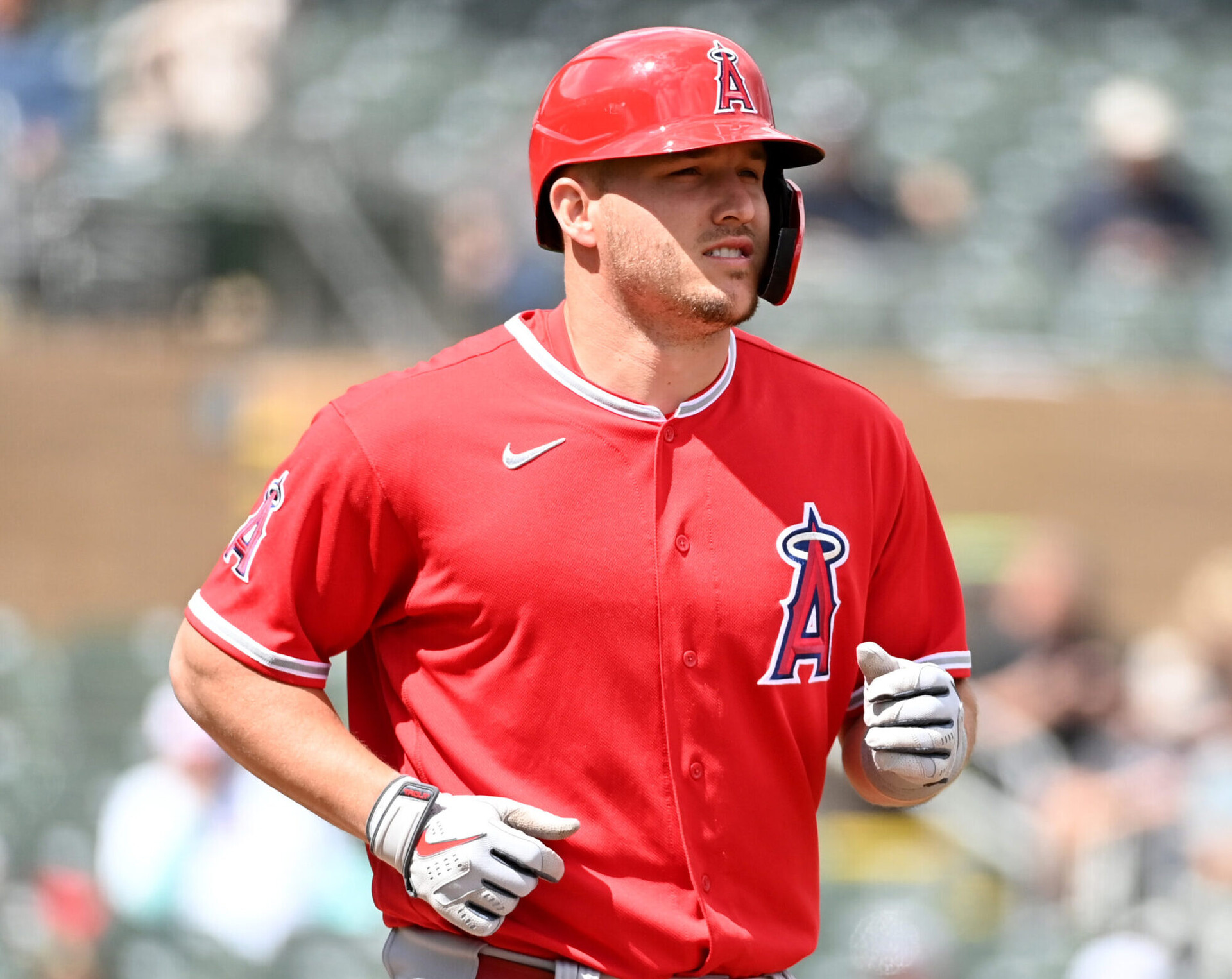 Mike Trout of the Los Angeles Angels runs out of the batter's box to first base during a spring training game against the Colorado Rockies