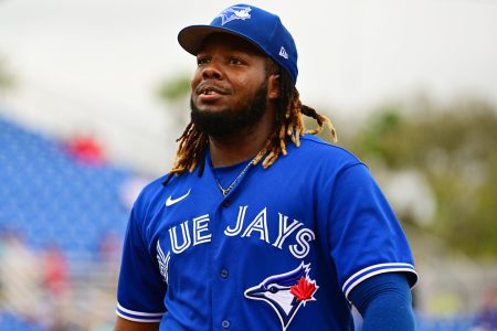 Vladimir Guerrero Jr. #27 of the Toronto Blue Jays returns to the dugout in the middle of the fourth inning against the Philadelphia Phillies during a Grapefruit League