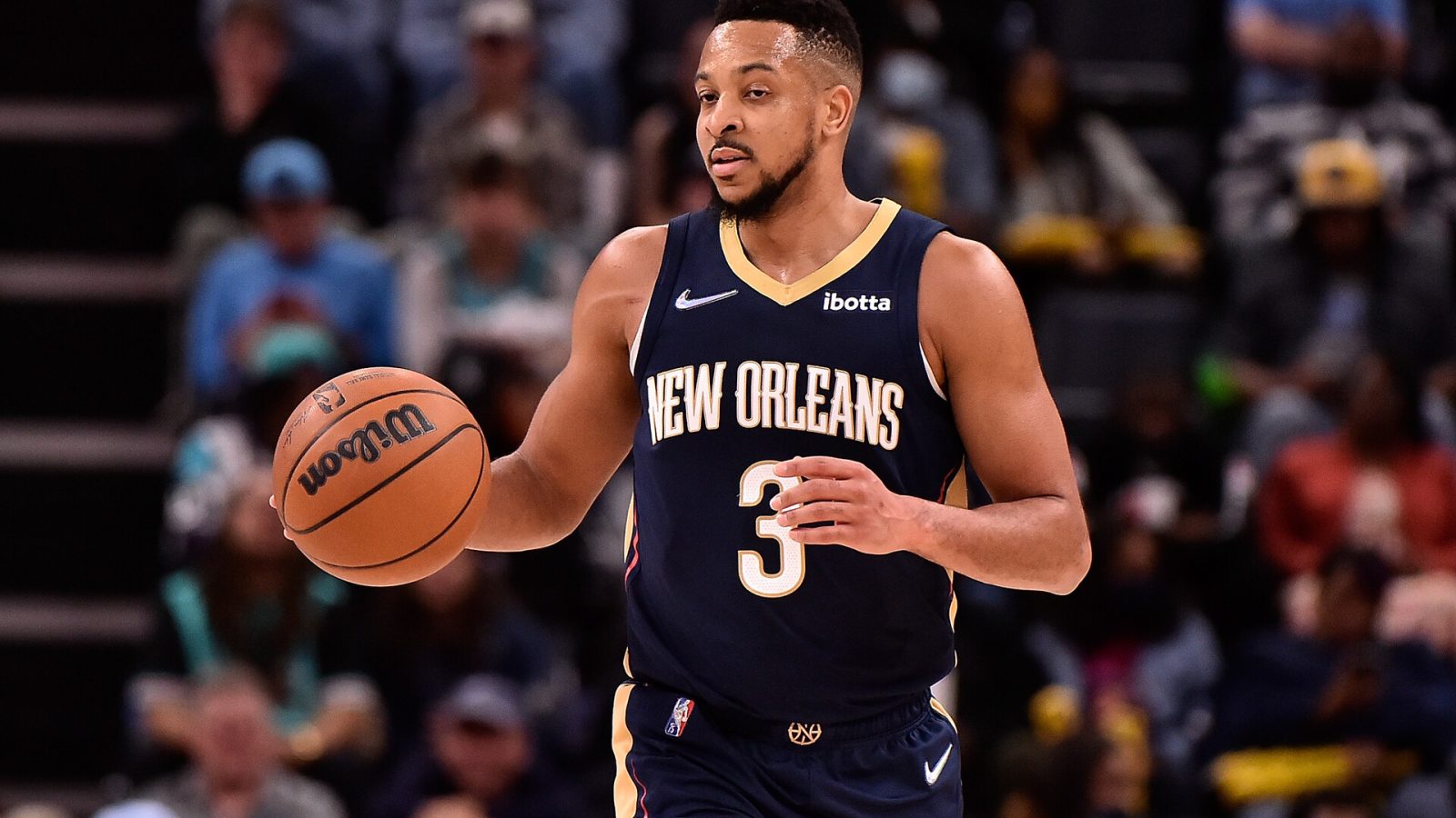 CJ McCollum #3 of the New Orleans Pelicans brings the ball up court during the game against the Memphis Grizzlies at FedExForum on April 09, 2022 in Memphis, Tennessee.