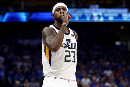 Royce O'Neale #23 of the Utah Jazz reacts after scoring against the Dallas Mavericks in the fourth quarter of Game One of the Western Conference First Round NBA Playoffs at American Airlines Center on April 16, 2022 in Dallas, Texas.