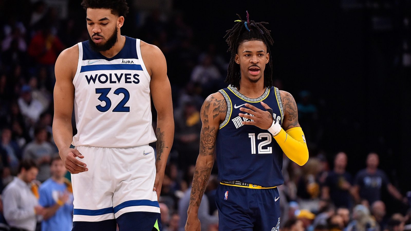 Karl-Anthony Towns #32 of the Minnesota Timberwolves and Ja Morant #12 of the Memphis Grizzlies during Game Two of the Western Conference First Round at FedExForum on April 19, 2022 in Memphis, Tennessee.