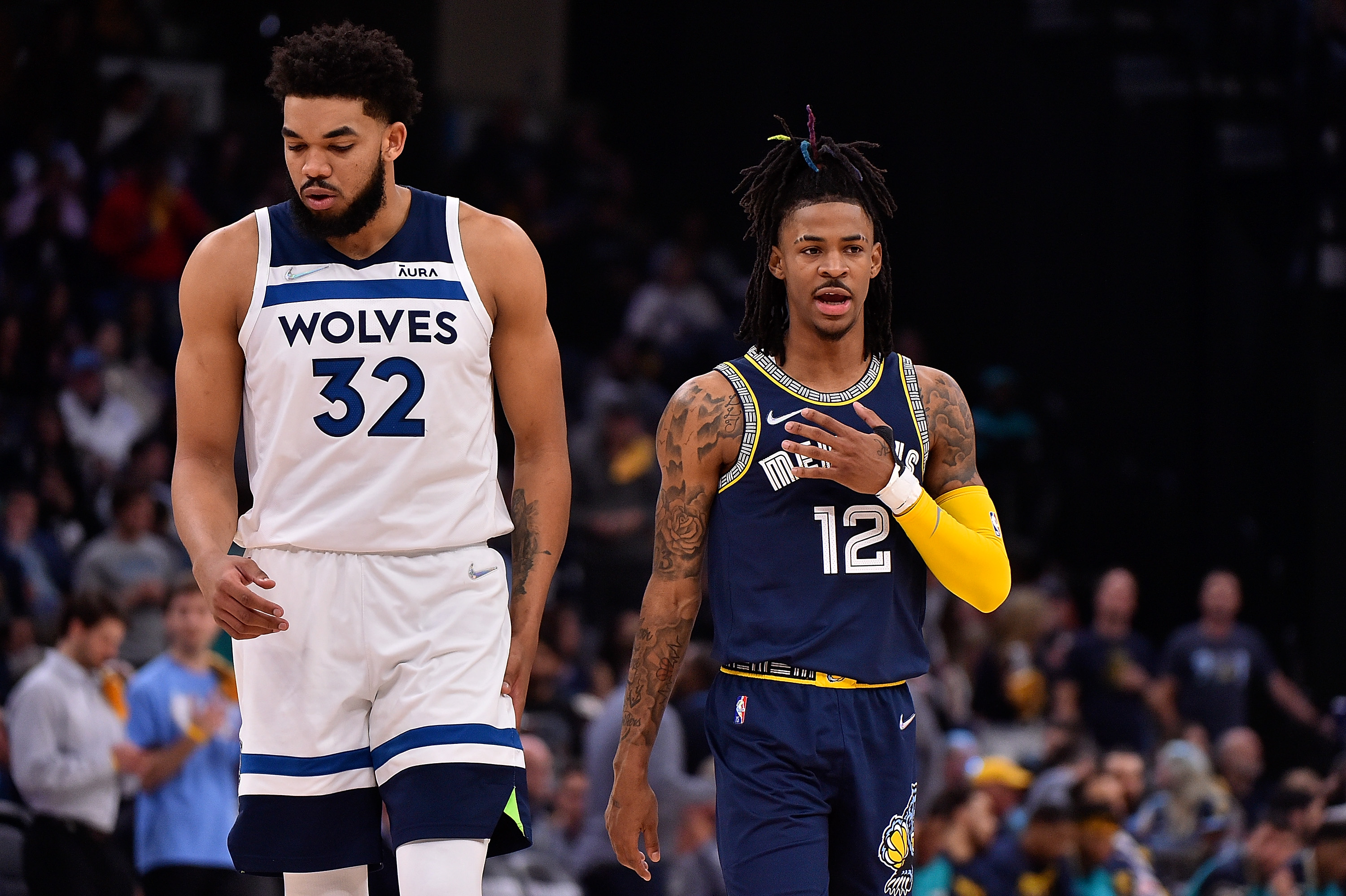 Karl-Anthony Towns #32 of the Minnesota Timberwolves and Ja Morant #12 of the Memphis Grizzlies during Game Two of the Western Conference First Round at FedExForum on April 19, 2022 in Memphis, Tennessee.