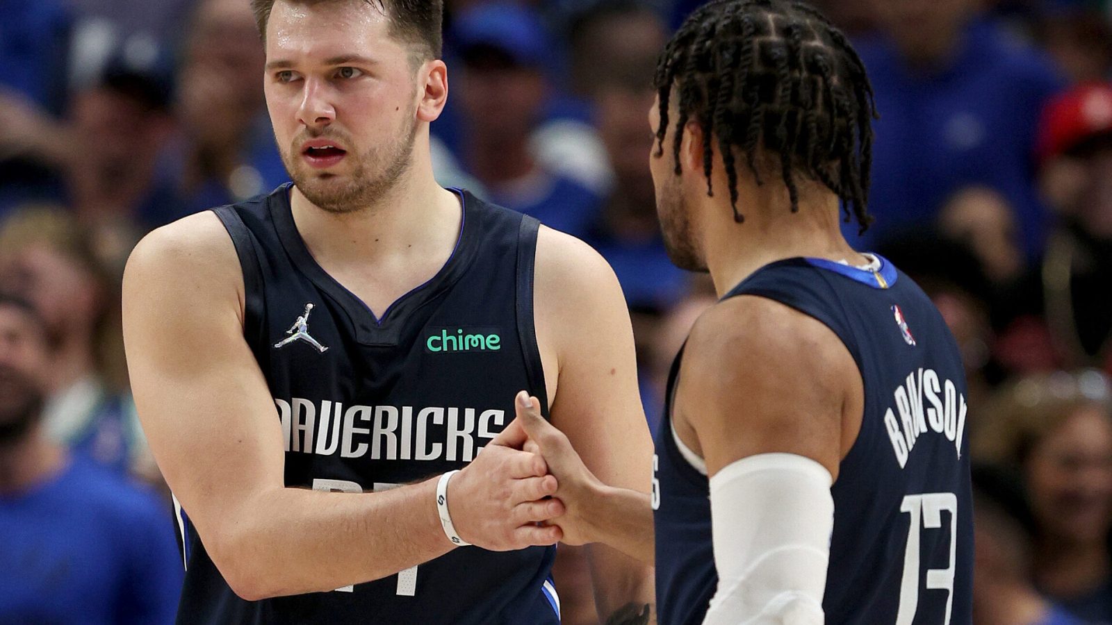 The Dallas Mavericks' Luka Doncic, left, and Jalen Brunson slap hands during Game 5 against the Utah Jazz on Monday, April 25, 2022, in Dallas.