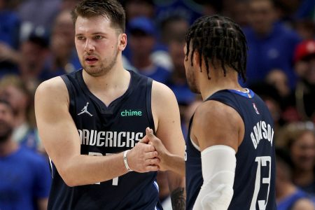 The Dallas Mavericks' Luka Doncic, left, and Jalen Brunson slap hands during Game 5 against the Utah Jazz on Monday, April 25, 2022, in Dallas.