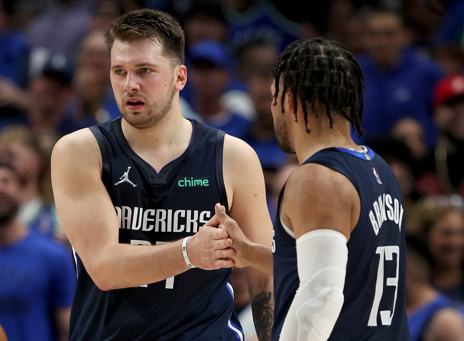 The Dallas Mavericks' Luka Doncic, left, and Jalen Brunson slap hands during Game 5 against the Utah Jazz on Monday, April 25, 2022, in Dallas.
