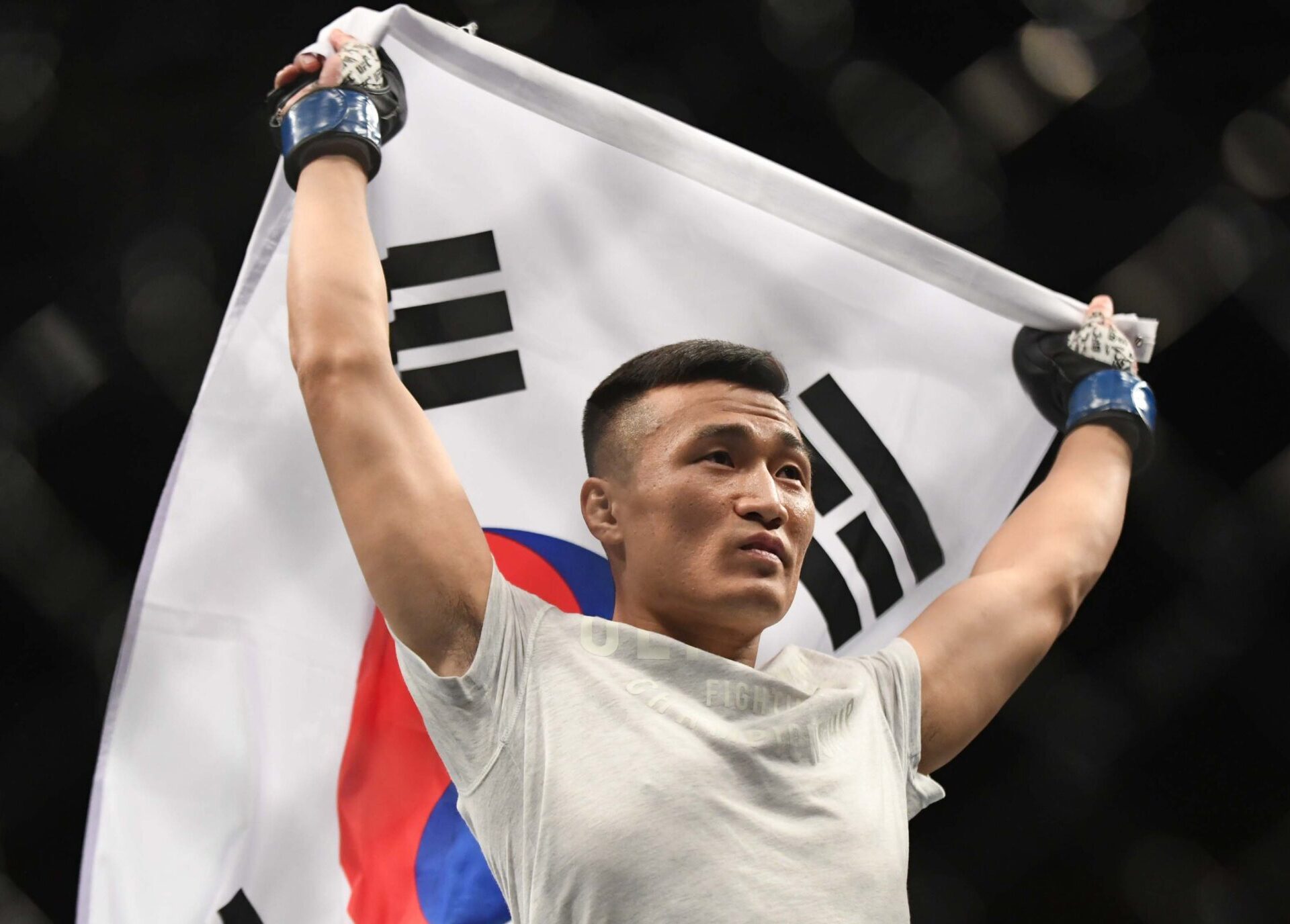 Chan Sung Jung (blue gloves) reacts to fight against Renato Moicano (red gloves) during UFC Fight Night at Ben Secours Wellness Arena.
