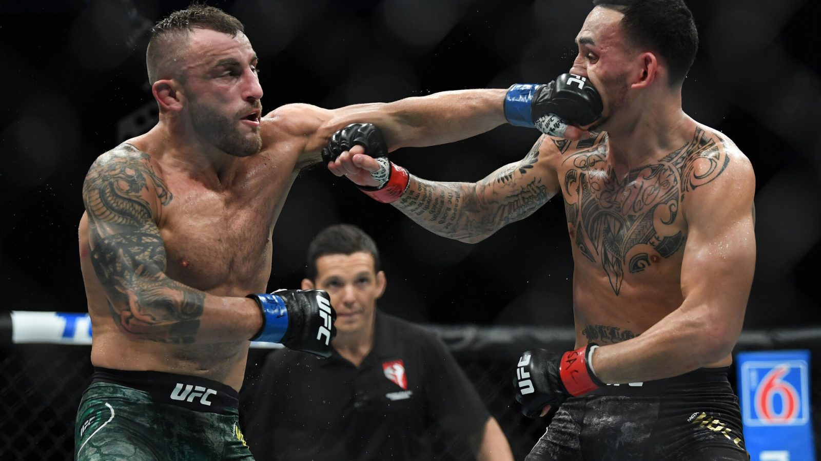 Alexander Volkanovski (left) lands a left hook on the nose of Max Holloway during UFC 245