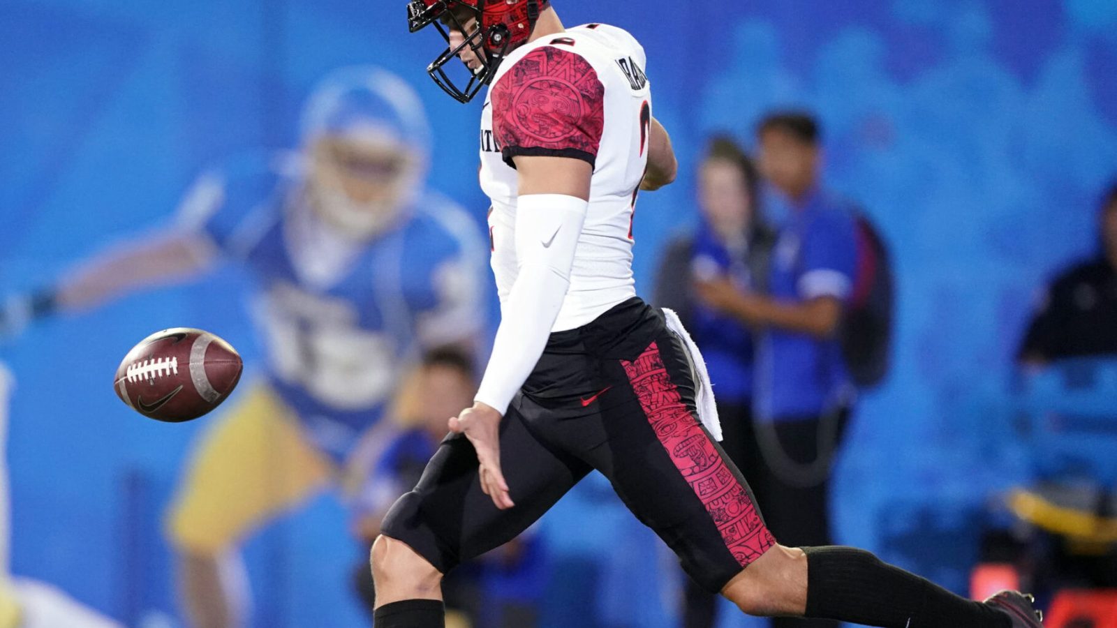 San Diego State Aztecs punter Matt Araiza drops the ball and prepares to launch a punt with his left leg during a game against the San Jose State Spartans