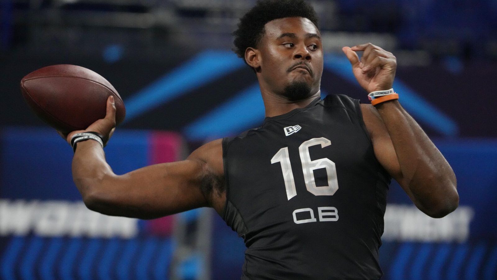 Liberty University quarterback Malik Willis reaches back with his right arm and prepares to throw a pass down the field during the 2022 NFL Scouting Combine
