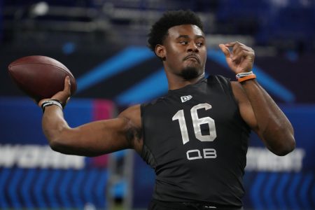 Liberty University quarterback Malik Willis reaches back with his right arm and prepares to throw a pass down the field during the 2022 NFL Scouting Combine