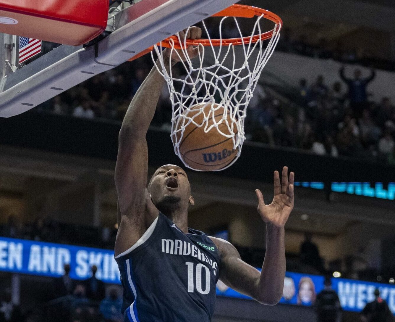 Dallas Mavericks forward Dorian Finney-Smith dunks the basketball with his right hand against the Utah Jazz