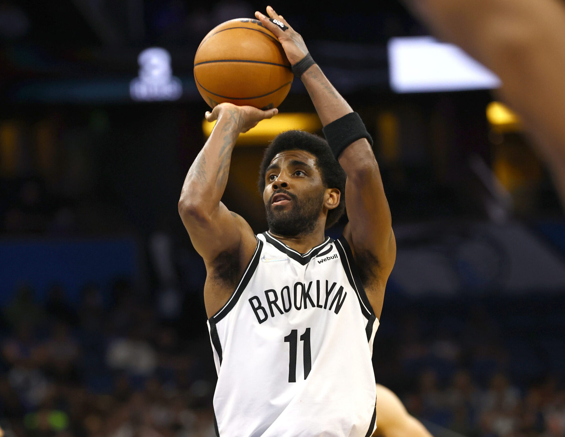 Brooklyn Nets guard Kyrie Irving shoots a free throw during a game against the Orlando Magic
