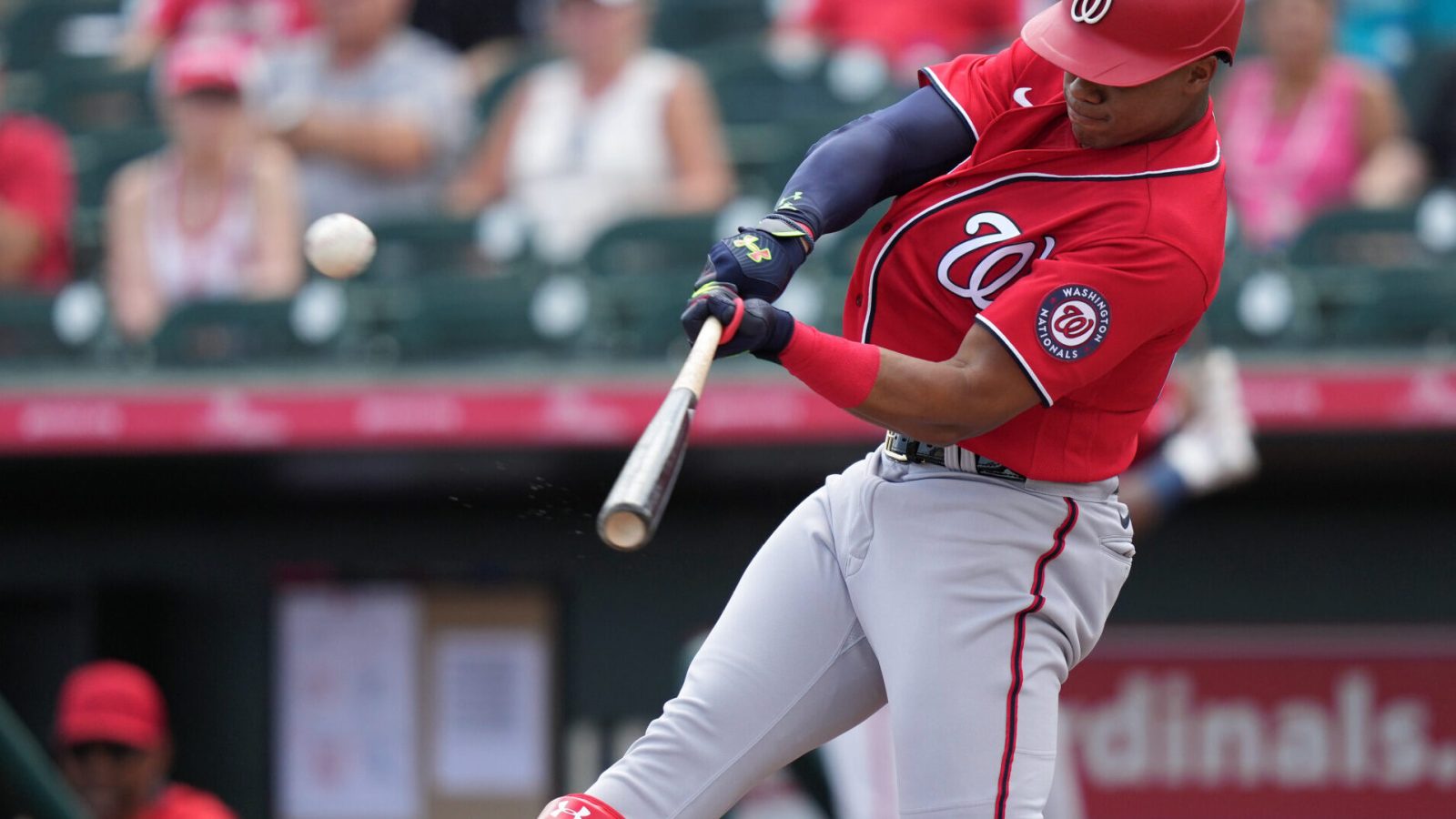 Washington Nationals right fielder Juan Soto swings at an approaching baseball and connects for a solo home run during a spring training game against the Miami Marlins