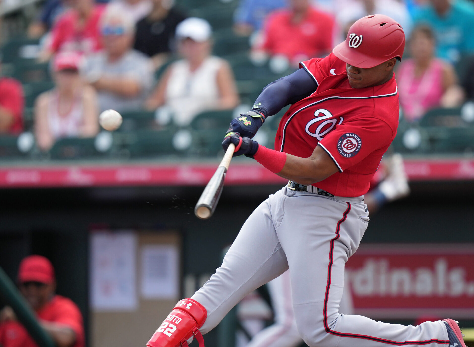 Washington Nationals right fielder Juan Soto swings at an approaching baseball and connects for a solo home run during a spring training game against the Miami Marlins