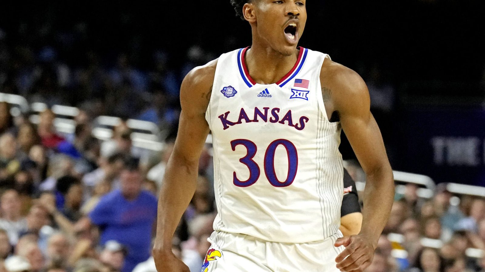Kansas Jayhawks guard Ochai Agbaji shoults after a play against the Villanova Wildcats in the 2022 NCAA men's basketball tournament Final Four semifinals