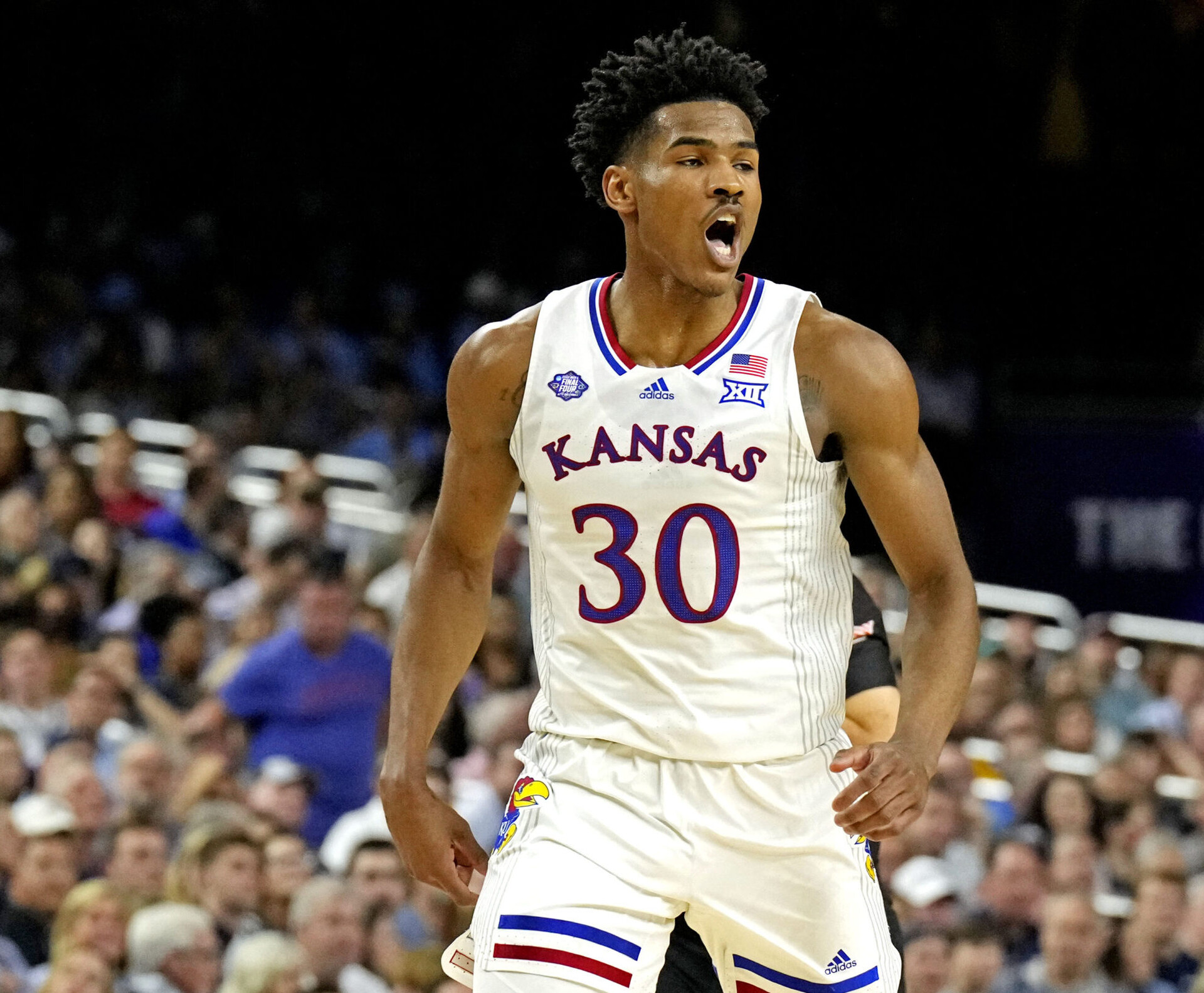 Kansas Jayhawks guard Ochai Agbaji shoults after a play against the Villanova Wildcats in the 2022 NCAA men's basketball tournament Final Four semifinals