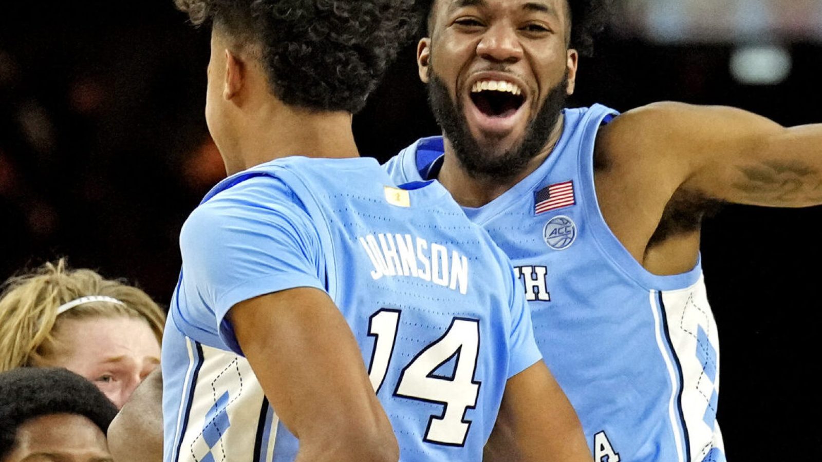 North Carolina Tar Heels guard Puff Johnson (14) celebrates with guard Dontrez Styles (3) after beating the Duke Blue Devils in the 2022 NCAA men's basketball tournament Final Four semifinals at Caesars Superdome in New Orleans on Saturday, April 2, 2022.