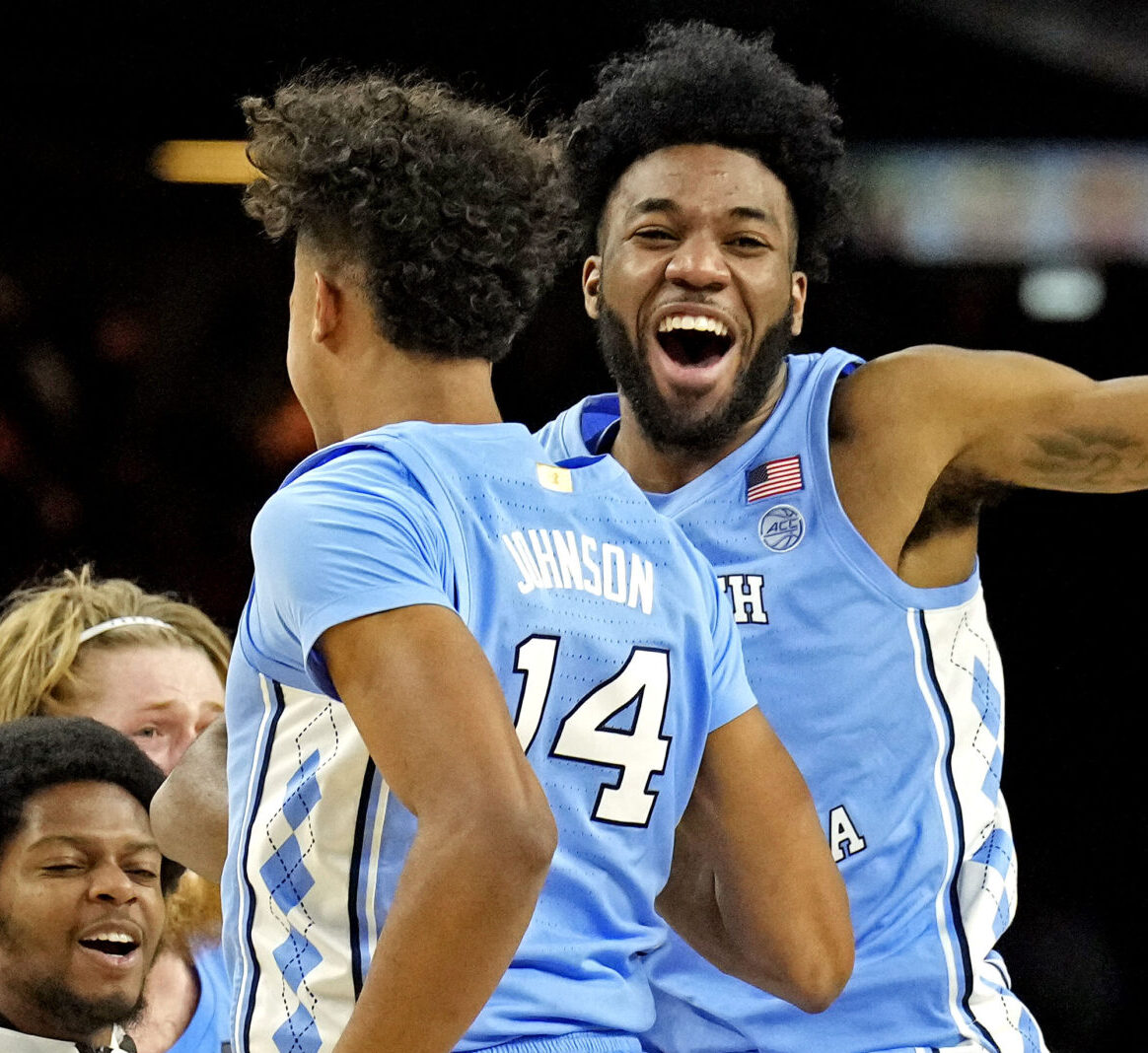 North Carolina Tar Heels guard Puff Johnson (14) celebrates with guard Dontrez Styles (3) after beating the Duke Blue Devils in the 2022 NCAA men's basketball tournament Final Four semifinals at Caesars Superdome in New Orleans on Saturday, April 2, 2022.