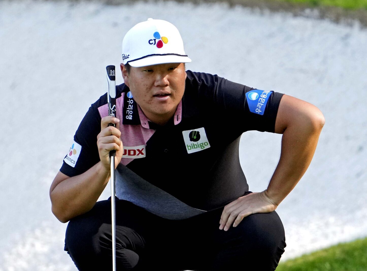 Sungjae Im lines up his putt on the 13th green during the first round of The Masters golf tournament on Thursday, April 7, 2022.