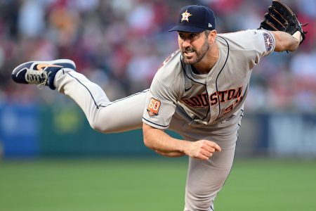 Houston Astros starting pitcher Justin Verlander grimaces as he follows through on a pitch against the Los Angeles Angels