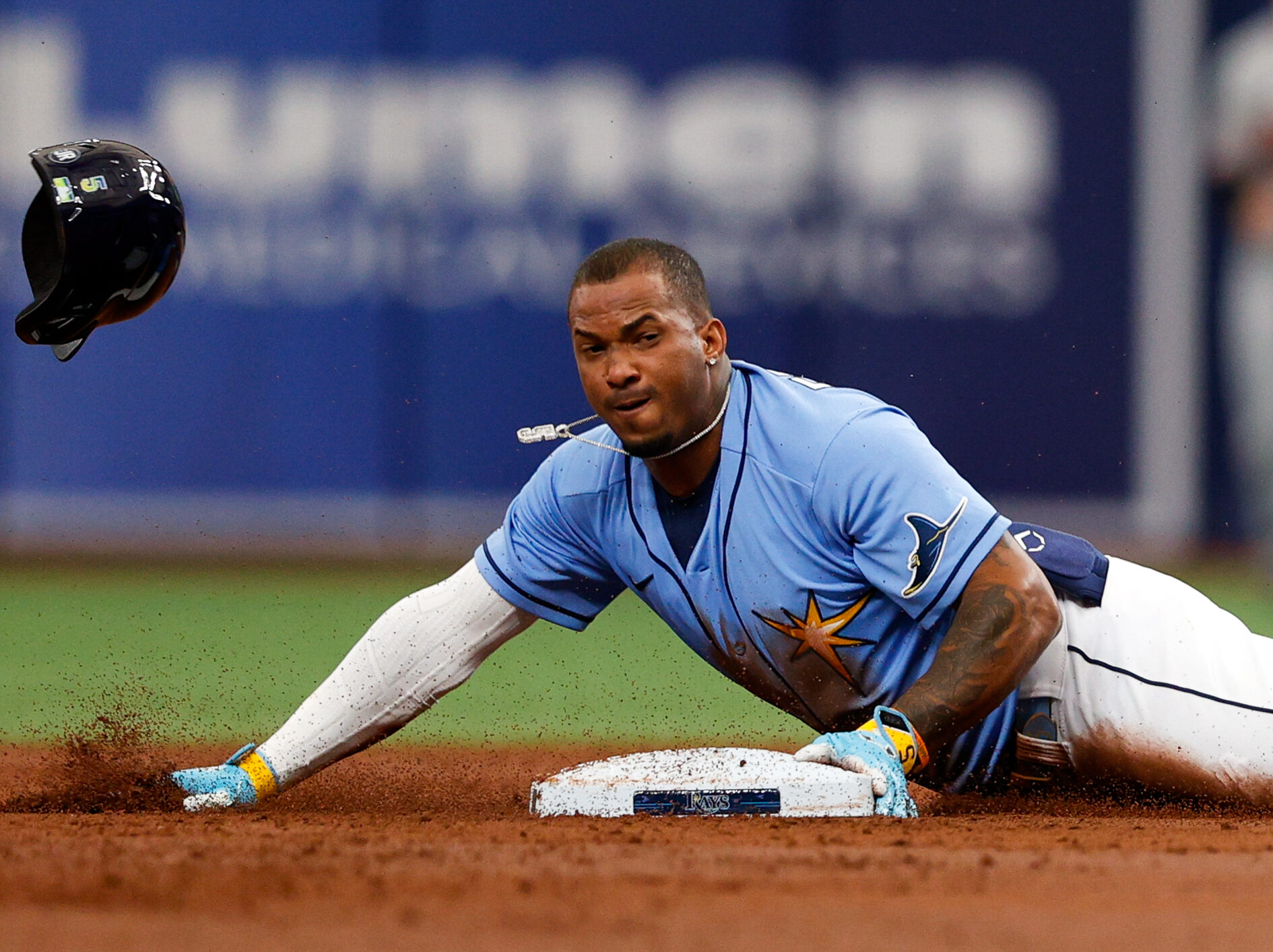 Tampa Bay Rays shortstop Wander Franco slides head first into second base and his helmet flies off after a successful steal attempt against the Baltimore Orioles
