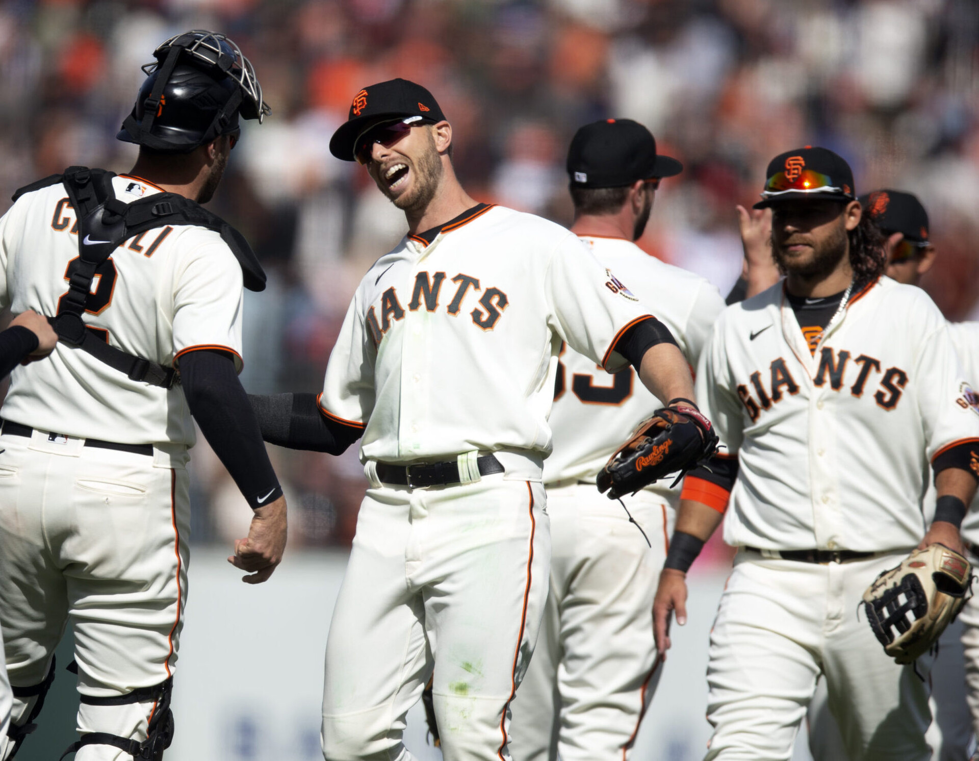 San Francisco Giants players celebrate a 3-2 victory over the Miami Marlins at Oracle Park.