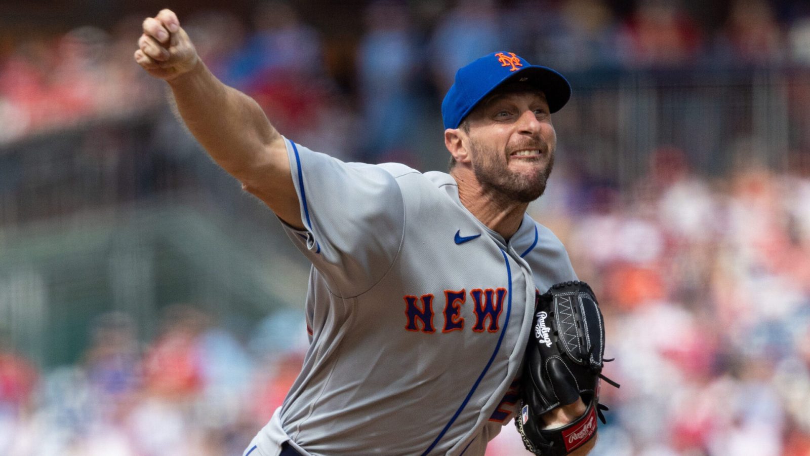 New York Mets right-handed pitcher Max Scherzer grimaces as he delivers a pitch against the Philadelphia Phillies