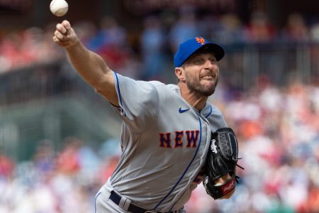 New York Mets right-handed pitcher Max Scherzer grimaces as he delivers a pitch against the Philadelphia Phillies