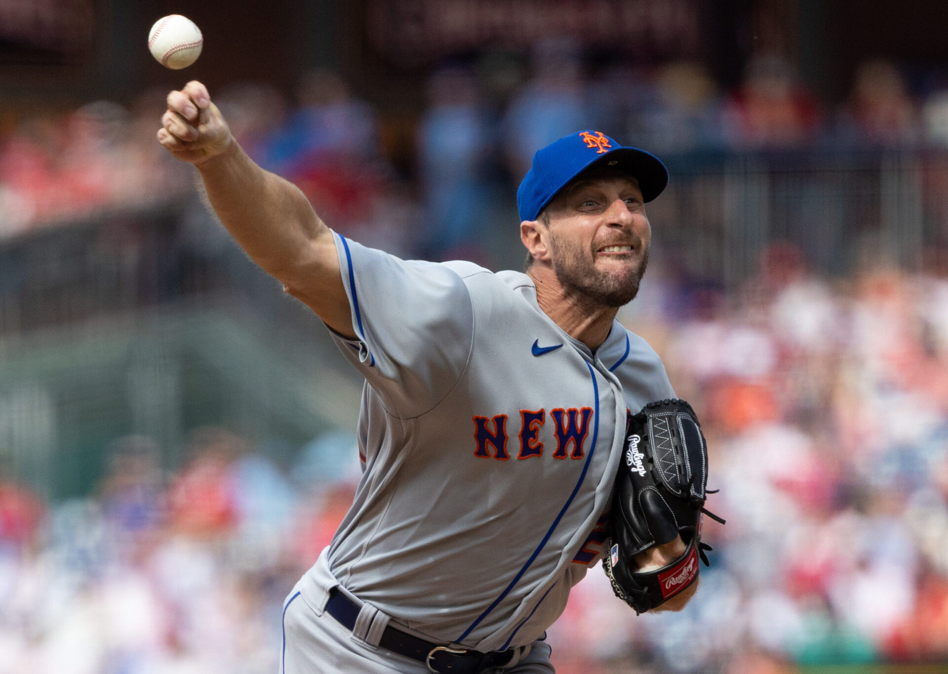 New York Mets right-handed pitcher Max Scherzer grimaces as he delivers a pitch against the Philadelphia Phillies
