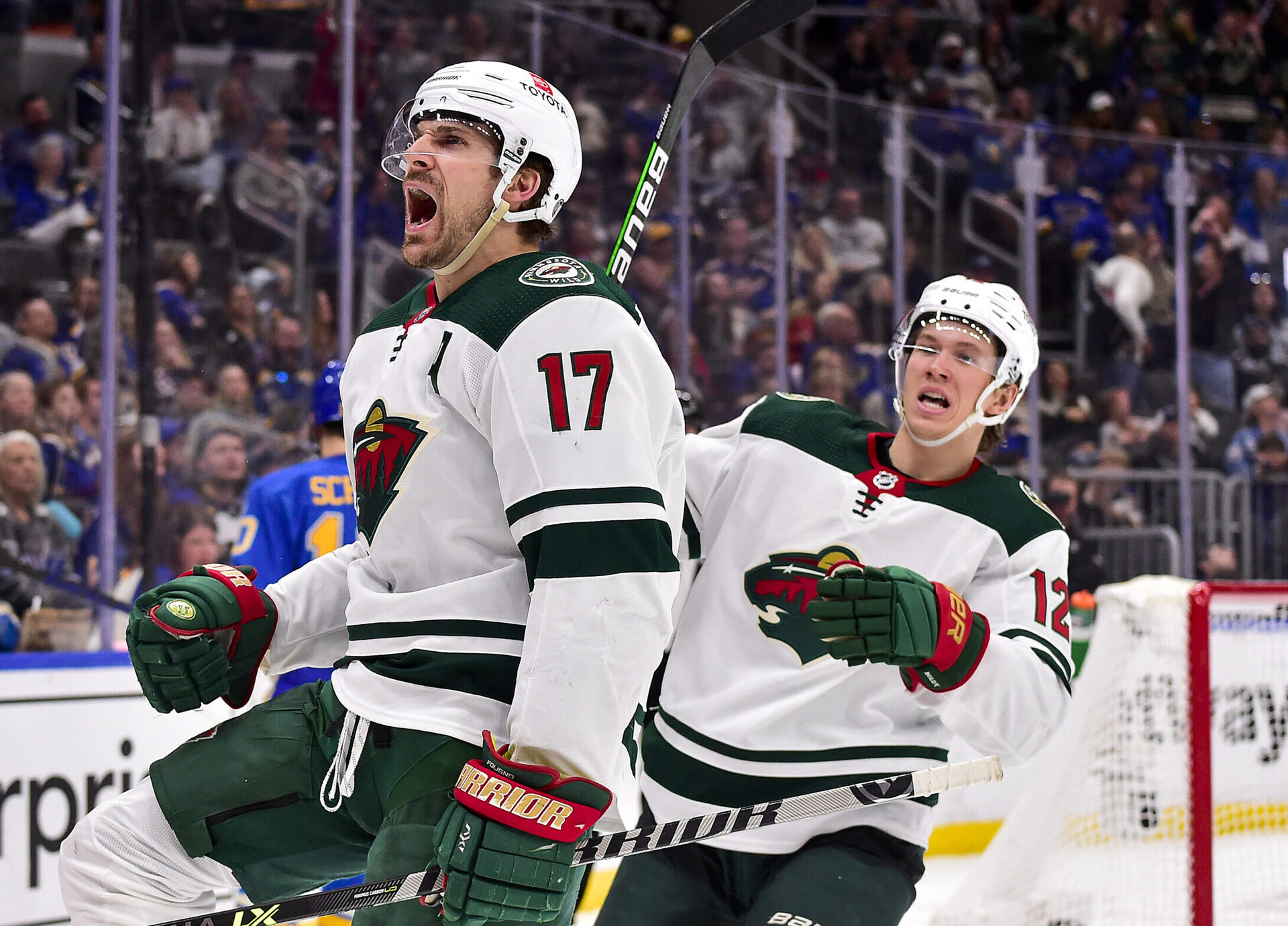 Minnesota Wild left wing Marcus Foligno, left, reacts after scoring against the St. Louis Blues during the third period at Enterprise Center in St. Louis on April 16, 2022.