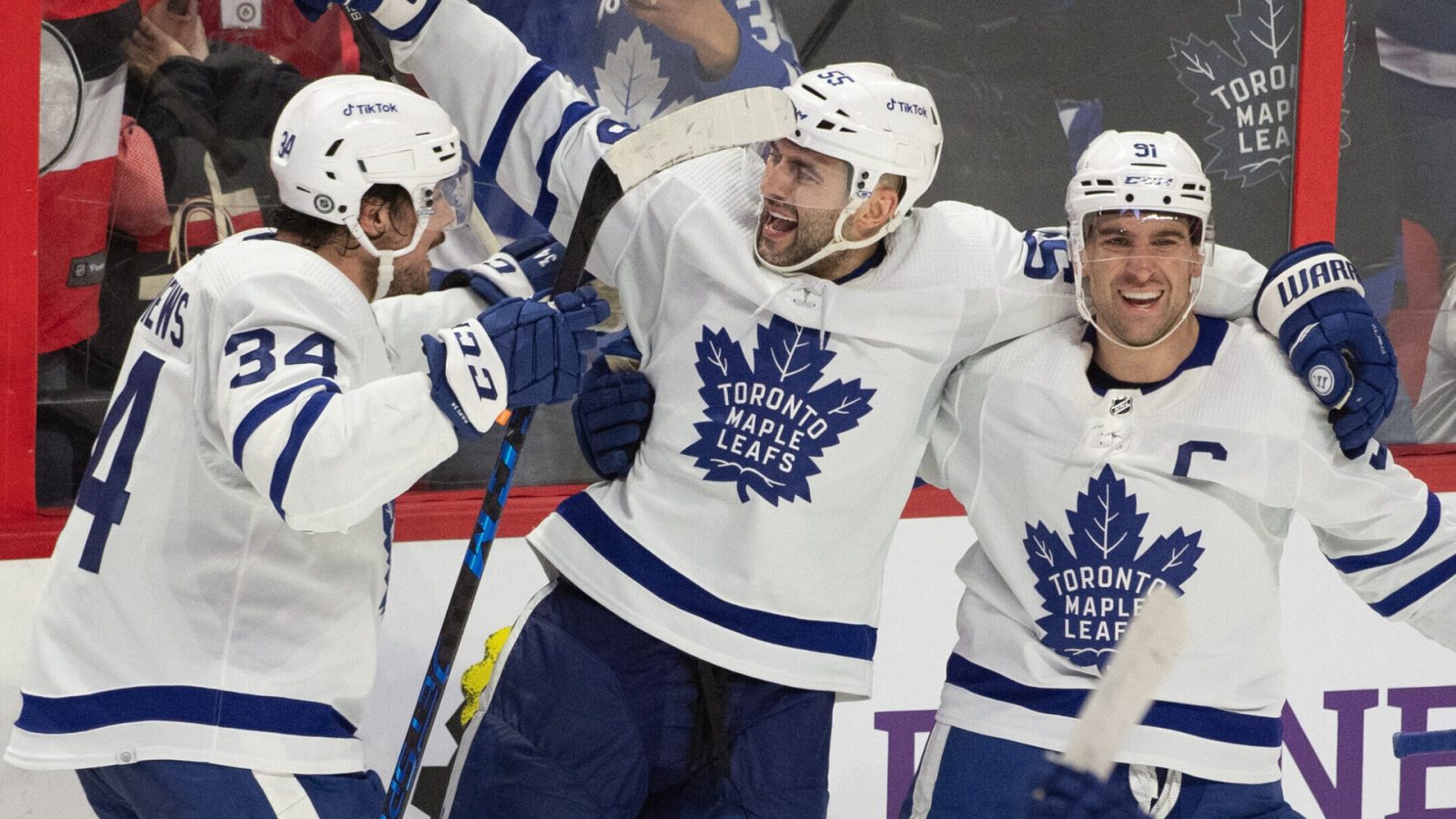 oronto Maple Leafs defenseman Mark Giordano, center, celebrates with Auston Matthews, left, and John Tavares (91) their win against the Ottawa Senators at the Canadian Tire Centre in Ottawa on Saturday, April 16.