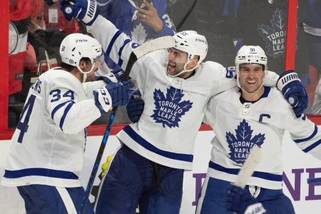 oronto Maple Leafs defenseman Mark Giordano, center, celebrates with Auston Matthews, left, and John Tavares (91) their win against the Ottawa Senators at the Canadian Tire Centre in Ottawa on Saturday, April 16.