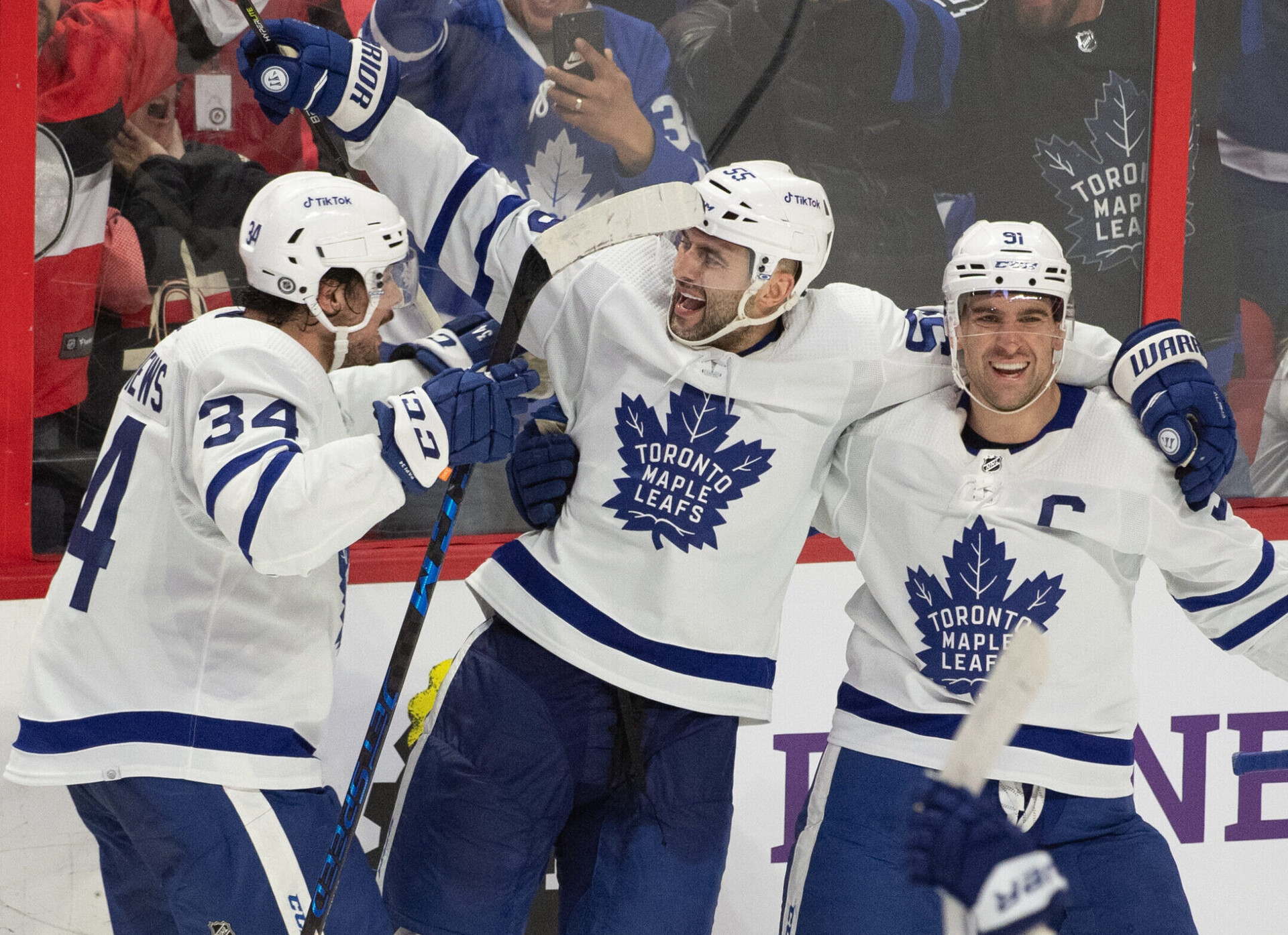oronto Maple Leafs defenseman Mark Giordano, center, celebrates with Auston Matthews, left, and John Tavares (91) their win against the Ottawa Senators at the Canadian Tire Centre in Ottawa on Saturday, April 16.