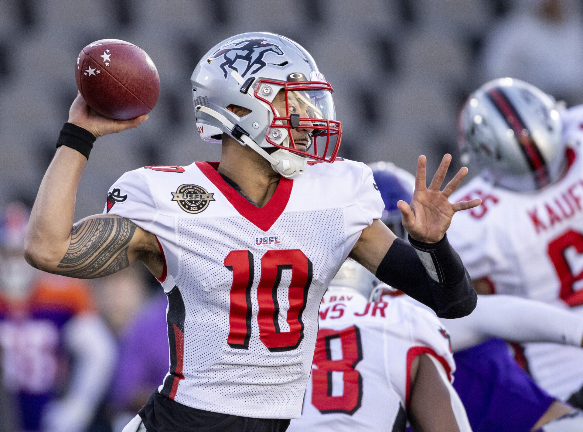 Tampa Bay Bandits quarterback Jordan Ta'amu reaches back to throw a pass against the Pittsburgh Maulers during a USFL game