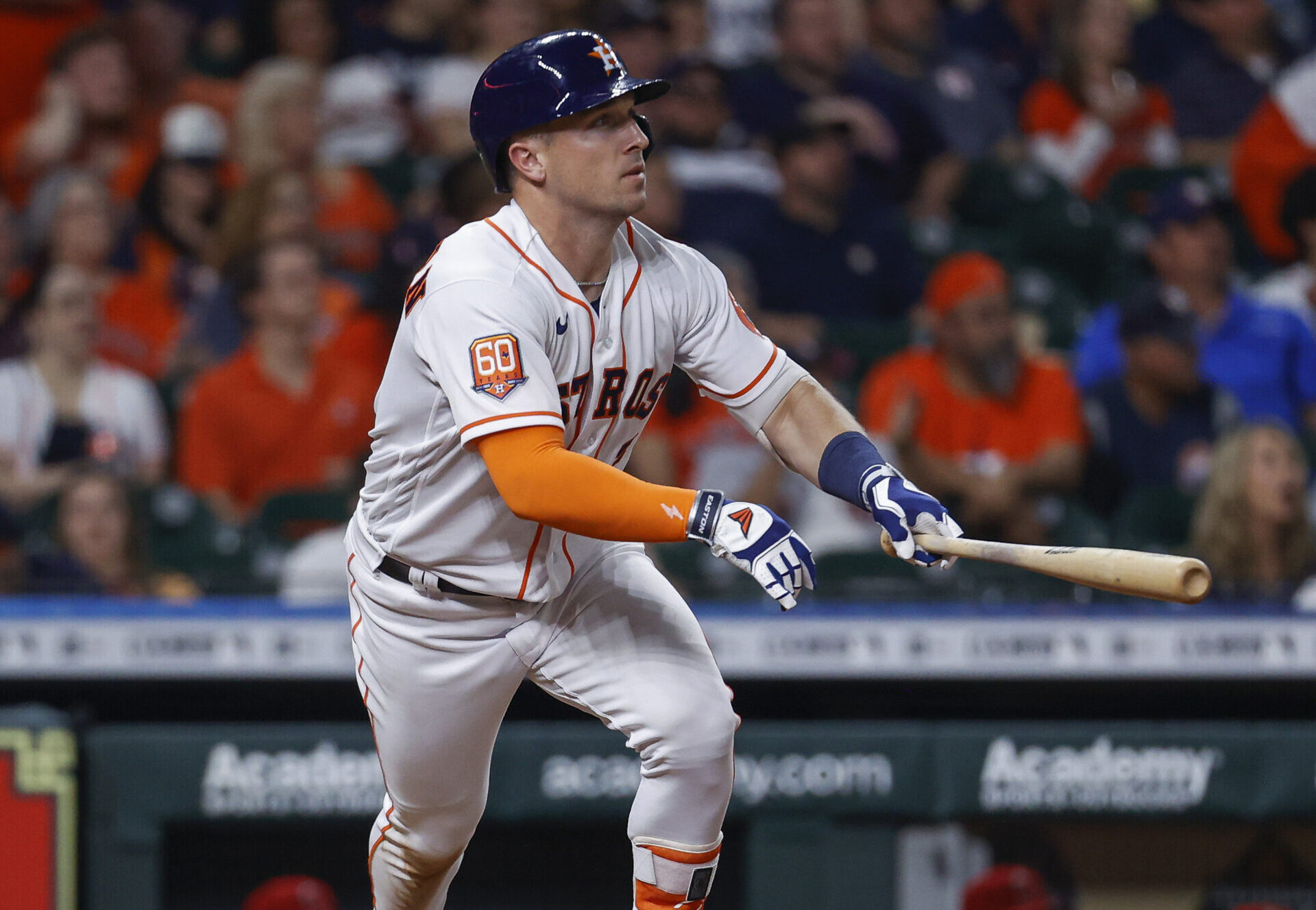 Houston Astros third baseman Alex Bregman prepares to drop the bat with his left hand and run the bases after hitting a double against the Los Angeles Angels