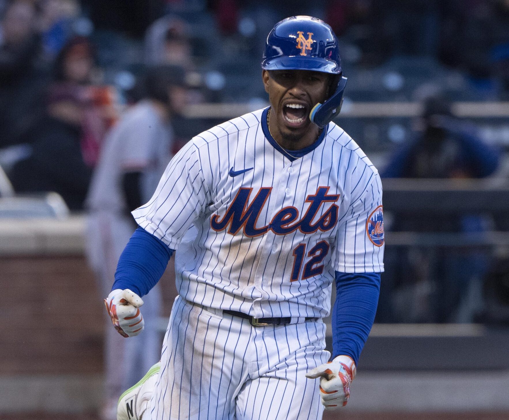 New York Mets shortstop Francisco Lindor shouts and pumps his fists after hitting a game-winning single against the San Francisco Giants