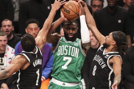Brooklyn Nets guard Patty Mills (8) forces a tie up against Boston Celtics guard Jaylen Brown (7) in the second quarter at Barclays Center in Brooklyn on Saturday, April 23, 2022.
