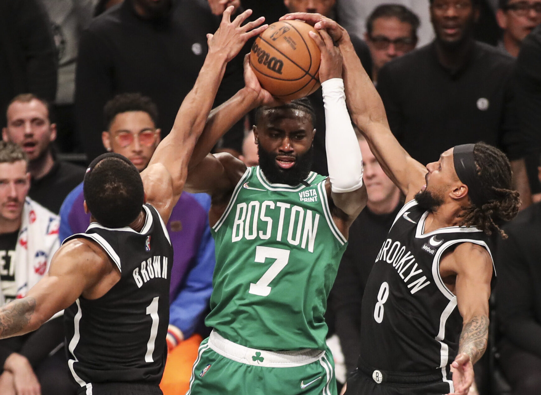 Brooklyn Nets guard Patty Mills (8) forces a tie up against Boston Celtics guard Jaylen Brown (7) in the second quarter at Barclays Center in Brooklyn on Saturday, April 23, 2022.