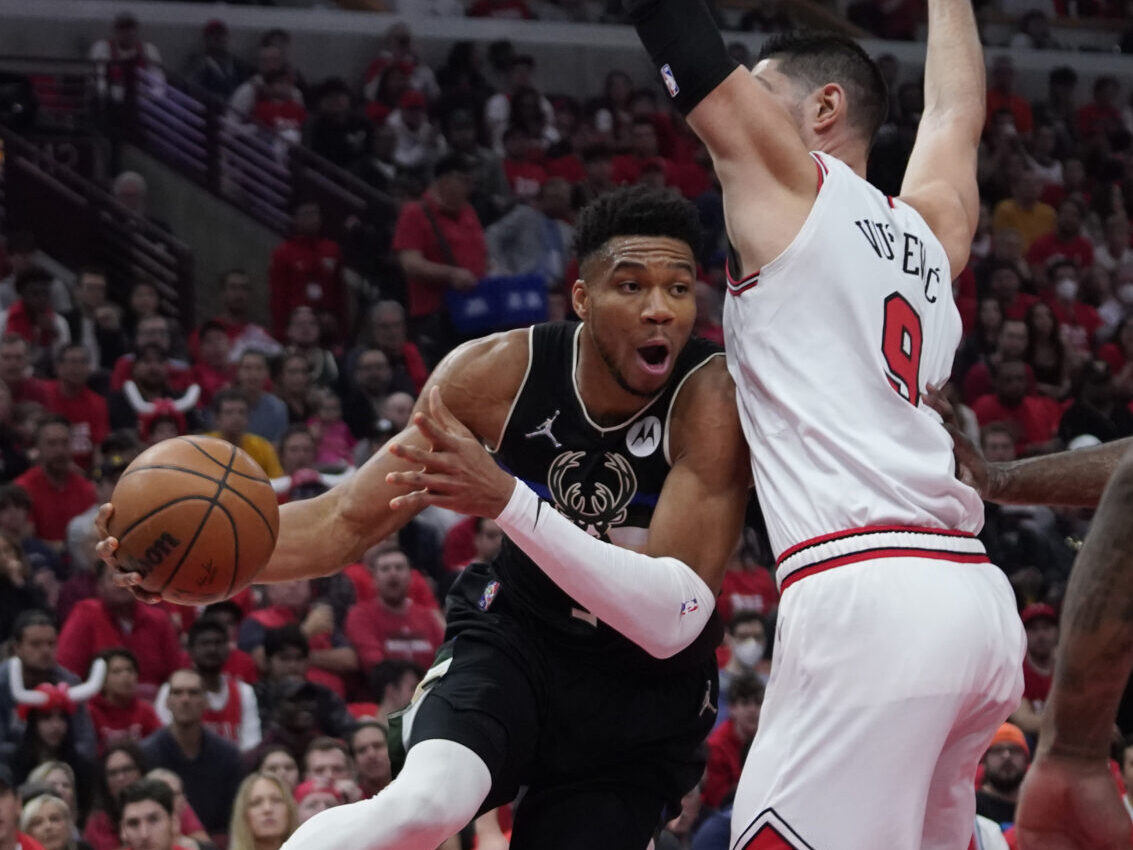 Milwaukee Bucks forward Giannis Antetokounmpo (34) drives to the basket while defended by Chicago Bulls center Nikola Vucevic (9) in the first half during game four of the first round for the 2022 NBA playoffs at United Center in Chicago on Sunday, April 24, 2022.