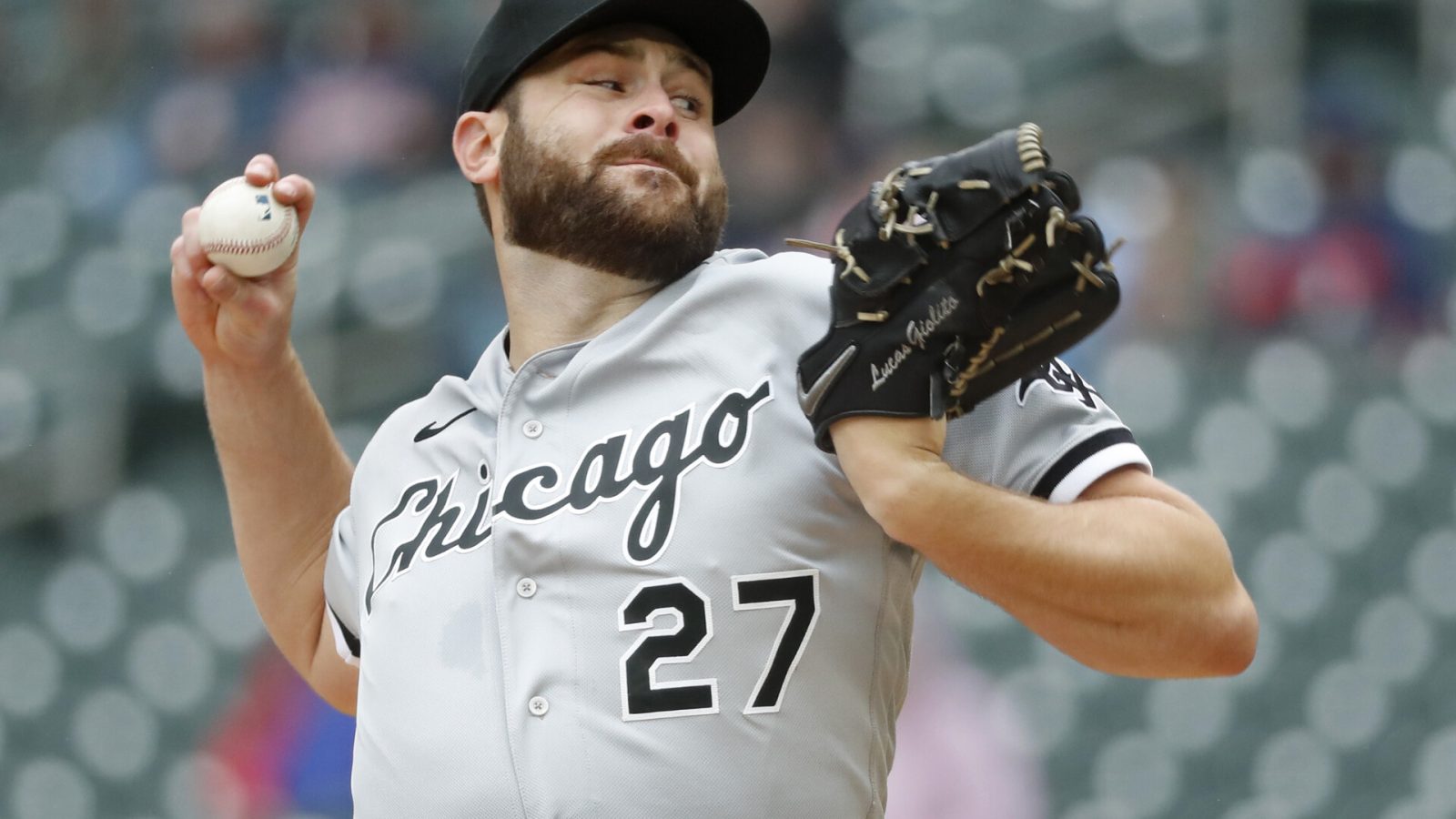 Chicago White Sox right-handed starting pitcher Lucas Giolito grips the baseball in his right hand and prepares to deliver a pitch against the Minnesota Twins