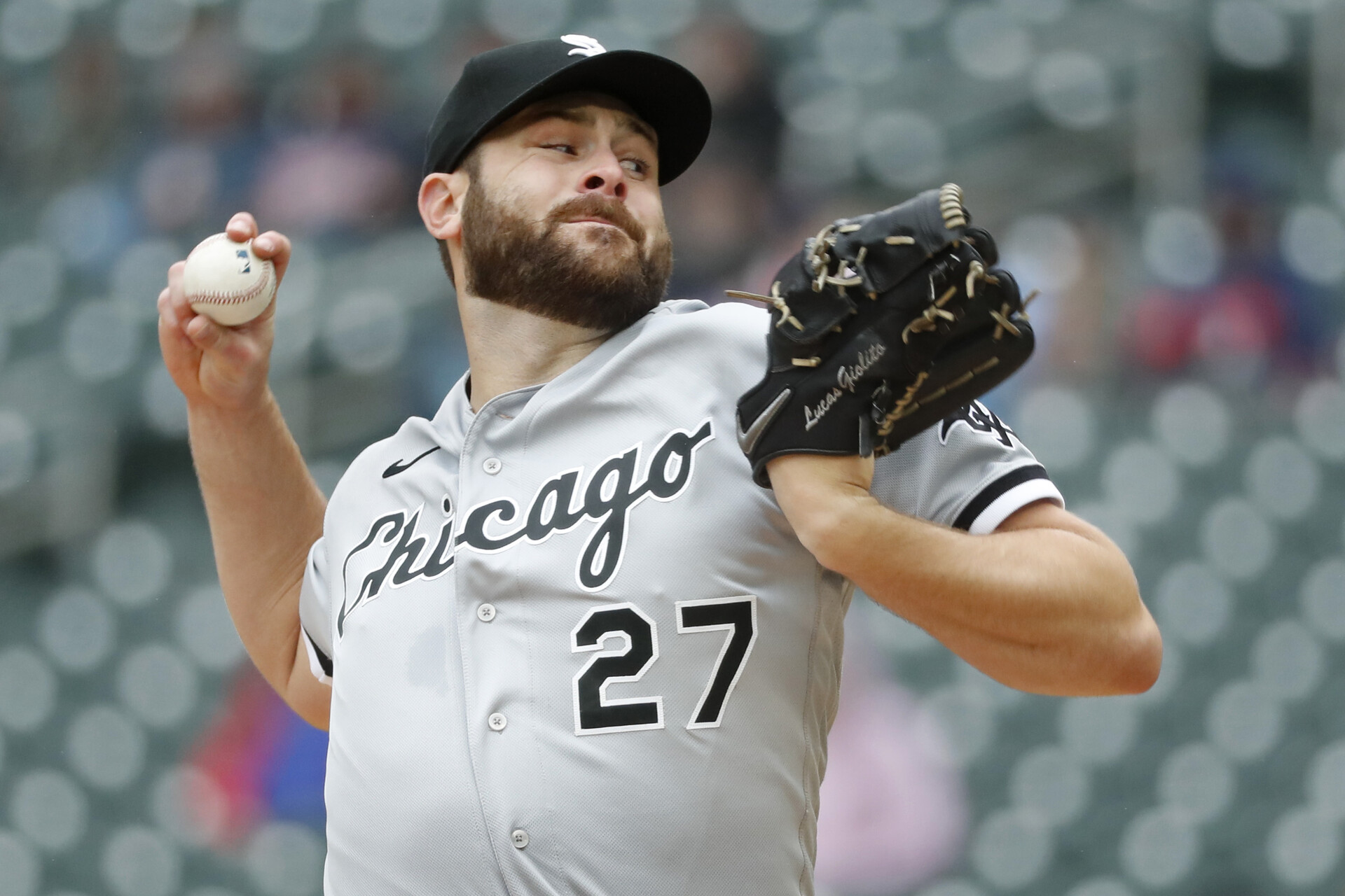 Chicago White Sox right-handed starting pitcher Lucas Giolito grips the baseball in his right hand and prepares to deliver a pitch against the Minnesota Twins