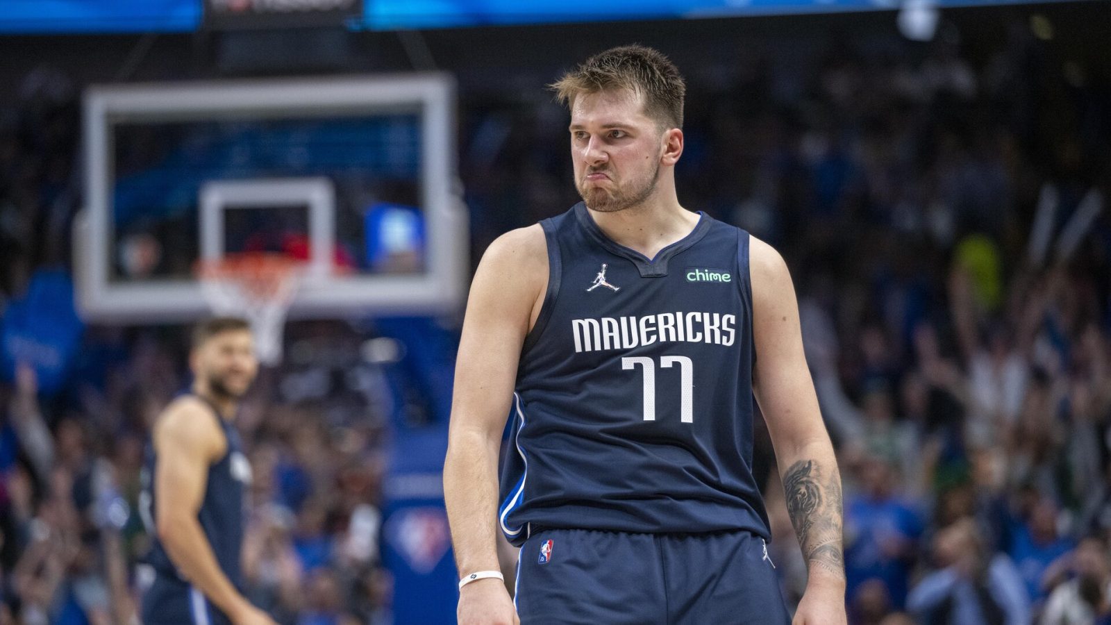 Dallas Mavericks guard Luka Doncic (77) celebrates making a basket against the Utah Jazz during the third quarter in game five of the first round for the 2022 NBA playoffs at American Airlines Center.