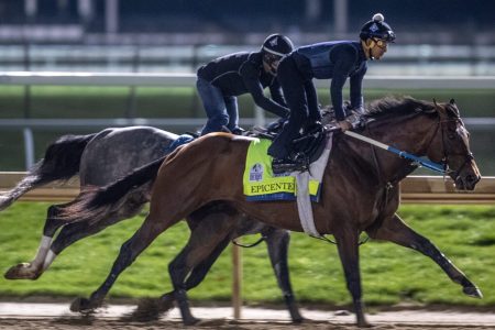 Kentucky Derby favorite, Epicenter, works out with a stable mate before dawn at Churchill Downs on April 24, 2022.