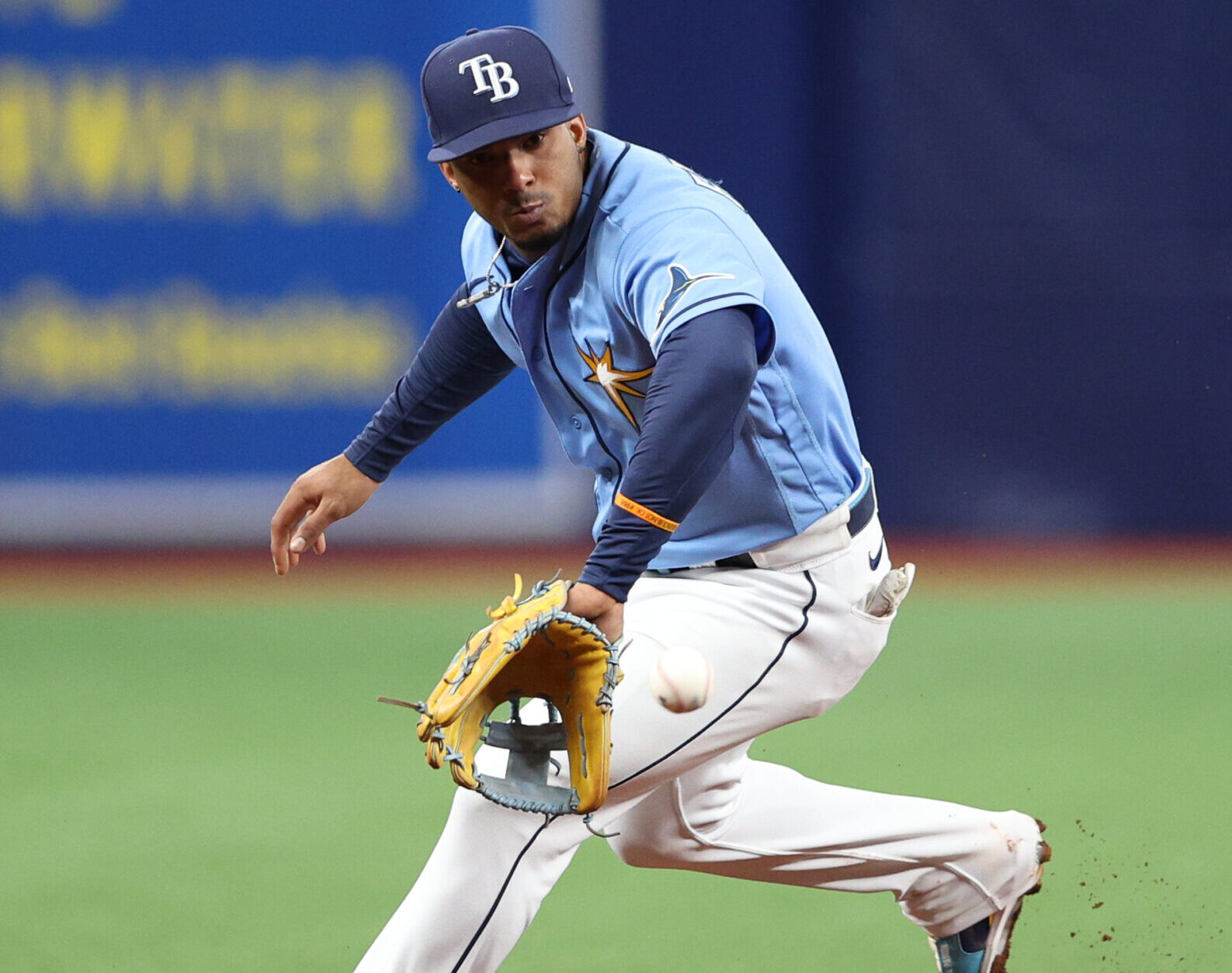 Tampa Bay Rays shortstop Wander Franco prepares to field the baseball with his backhand during a game against the Seattle Mariners