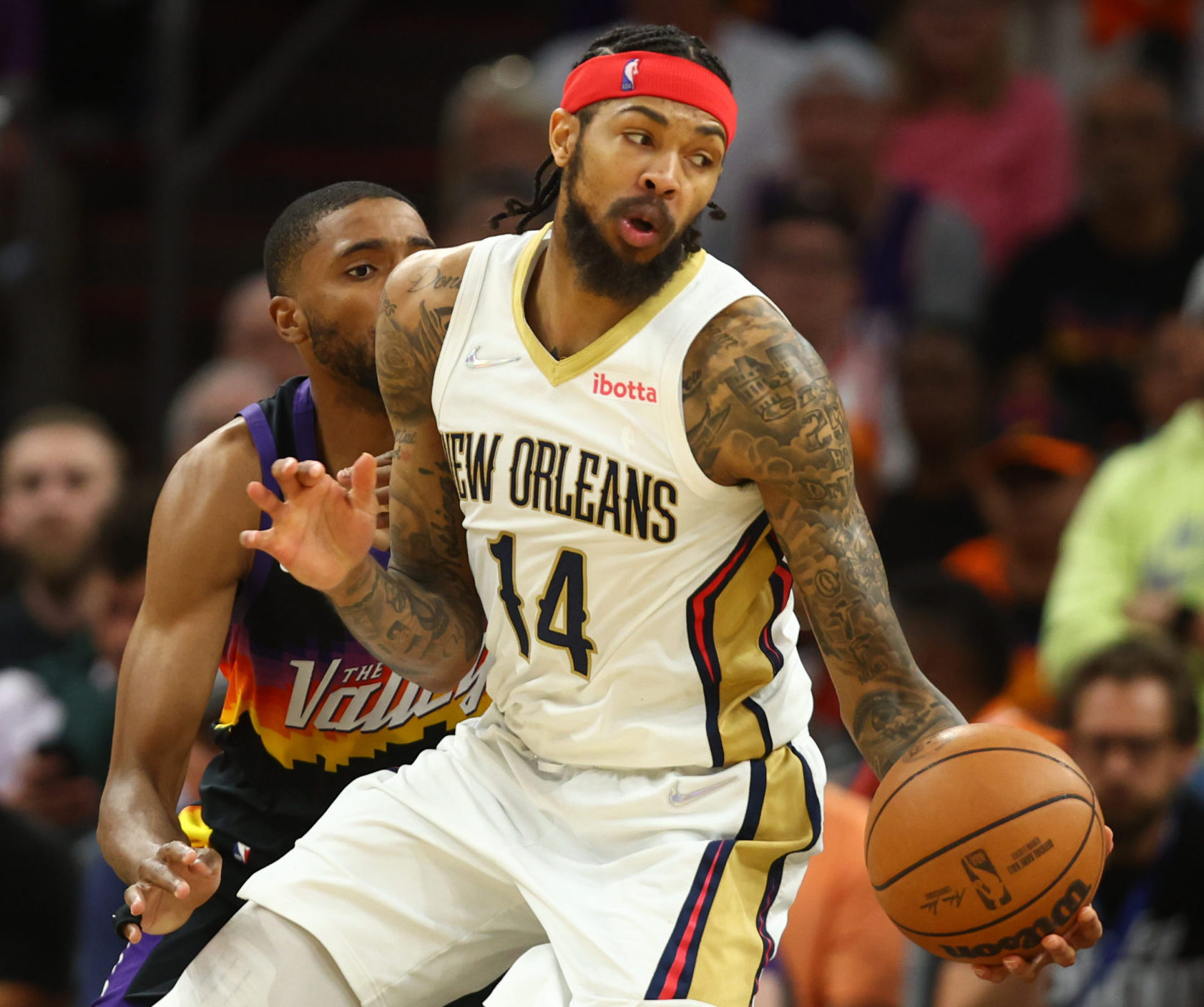 New Orleans Pelicans forward Brandon Ingram, front, against the Phoenix Suns in the second half during Game 5 of the first round for the 2022 NBA playoffs at Footprint Center in Phoenix on Tuesday, April 26, 2022.