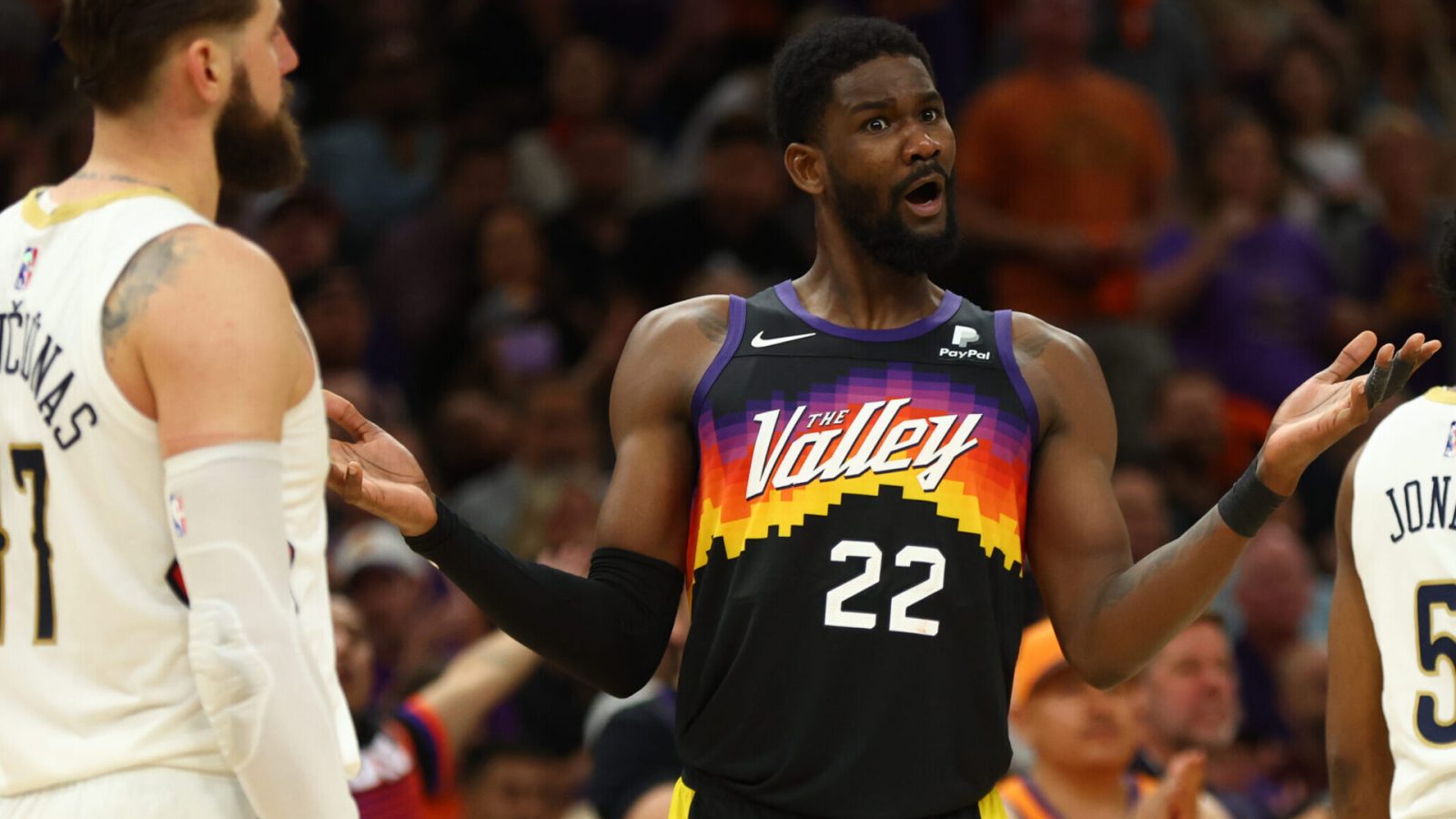 Phoenix Suns center Deandre Ayton, right, reacts against the New Orleans Pelicans in the second half during Game 5 of the first round for the 2022 NBA playoffs at Footprint Center in Phoenix on Tuesday, April 26, 2022.