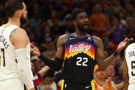 Phoenix Suns center Deandre Ayton, right, reacts against the New Orleans Pelicans in the second half during Game 5 of the first round for the 2022 NBA playoffs at Footprint Center in Phoenix on Tuesday, April 26, 2022.