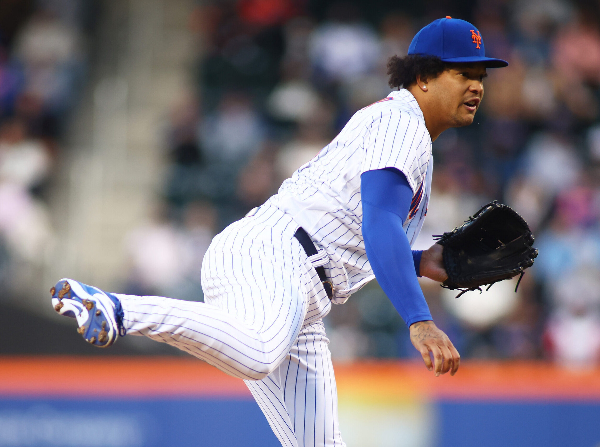 New York Mets right-handed pitcher Taijuan Walker follows through while kicking his right leg in the air against Philadelphia on Saturday, April 30, 2022, in New York.